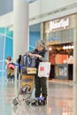 Woman checking her bag at Icheon Airport, Seoul, South Korea
